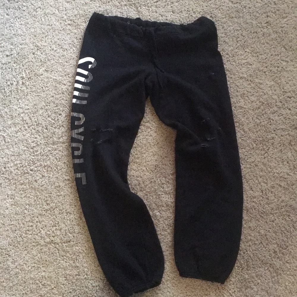 Distressed black SoulCycle sweat pants